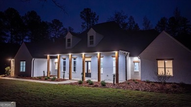 EXPERIENCE A PERFECT BLEND OF LUXURY, COMFORT, AND BREATHTAKING on Harbor Club Golf and Country Club in Georgia - for sale on GolfHomes.com, golf home, golf lot