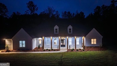 EXPERIENCE A PERFECT BLEND OF LUXURY, COMFORT, AND BREATHTAKING on Harbor Club Golf and Country Club in Georgia - for sale on GolfHomes.com, golf home, golf lot