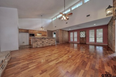 Step inside this charming single-story cottage and discover the on Hide-A-Way Lake Golf Course in Texas - for sale on GolfHomes.com, golf home, golf lot