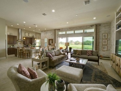 Step into luxury living in the heart of Lake Nona's prestigious on Eagle Creek Golf Club in Florida - for sale on GolfHomes.com, golf home, golf lot