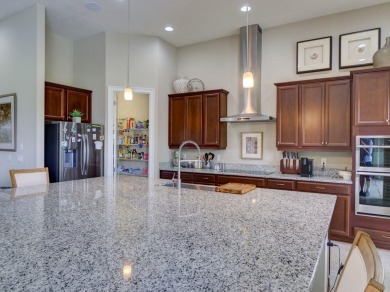 Step into luxury living in the heart of Lake Nona's prestigious on Eagle Creek Golf Club in Florida - for sale on GolfHomes.com, golf home, golf lot