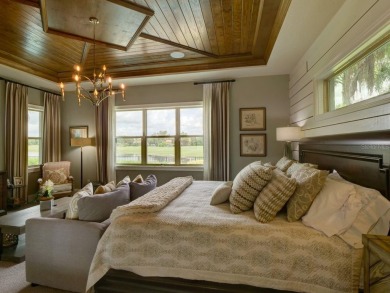 Step into luxury living in the heart of Lake Nona's prestigious on Eagle Creek Golf Club in Florida - for sale on GolfHomes.com, golf home, golf lot