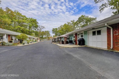 Updated & move-in ready, this 2 BR, 2 Bath home with a one car on Greenbriar Woodlands in New Jersey - for sale on GolfHomes.com, golf home, golf lot