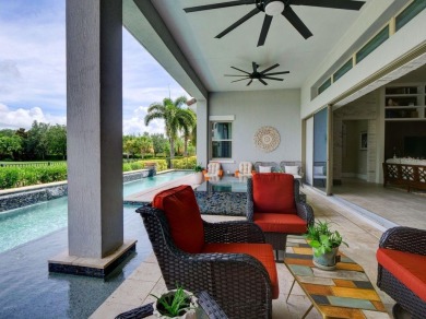 Step into luxury living in the heart of Lake Nona's prestigious on Eagle Creek Golf Club in Florida - for sale on GolfHomes.com, golf home, golf lot