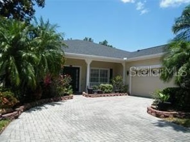 This is a MUST SEE....waiting on your personal touches. Exterior on Stonegate Golf Club in Florida - for sale on GolfHomes.com, golf home, golf lot