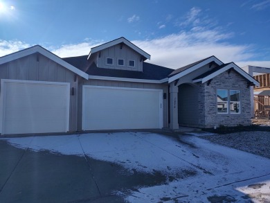 This incredible home features a beautiful kitchen with quartz on Hunters Point Golf Club in Idaho - for sale on GolfHomes.com, golf home, golf lot