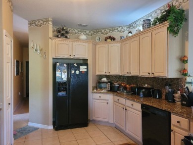 This is a MUST SEE....waiting on your personal touches. Exterior on Stonegate Golf Club in Florida - for sale on GolfHomes.com, golf home, golf lot
