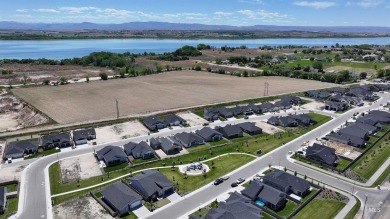 This incredible home features a beautiful kitchen with quartz on Hunters Point Golf Club in Idaho - for sale on GolfHomes.com, golf home, golf lot