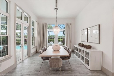 Stunning luxury coastal living in the highly sought-after Marsh on The Golf Club At Fiddlers Creek in Florida - for sale on GolfHomes.com, golf home, golf lot