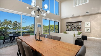 Located within the gated Queens Harbour enclave in Bay Isles on Longboat Key Golf Club Resort in Florida - for sale on GolfHomes.com, golf home, golf lot