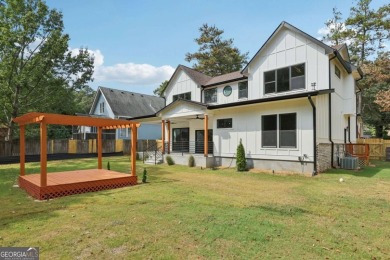 Experience modern luxury in this newly built custom farmhouse on East Lake Golf Club in Georgia - for sale on GolfHomes.com, golf home, golf lot