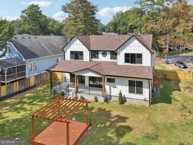 Experience modern luxury in this newly built custom farmhouse on East Lake Golf Club in Georgia - for sale on GolfHomes.com, golf home, golf lot