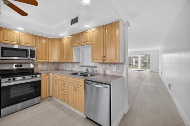 Presenting Victoria's Beauty - Your Move-In Ready Paradise! Step on Wynmoor Golf Course in Florida - for sale on GolfHomes.com, golf home, golf lot