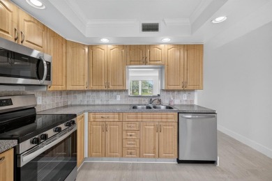 Presenting Victoria's Beauty - Your Move-In Ready Paradise! Step on Wynmoor Golf Course in Florida - for sale on GolfHomes.com, golf home, golf lot