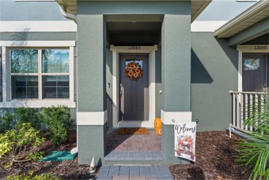 Charming Interior Unit Townhome with Courtyard Views in on Orange County National Golf Center and Lodge in Florida - for sale on GolfHomes.com, golf home, golf lot