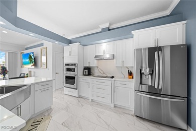 Highly desirable Gulf access home in Southwest Cape Coral, fully on Royal Tee Country Club in Florida - for sale on GolfHomes.com, golf home, golf lot