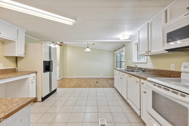 *PRICE REDUCED* This well-maintained home, with a fenced-in on Oyster Bay Golf Links in North Carolina - for sale on GolfHomes.com, golf home, golf lot