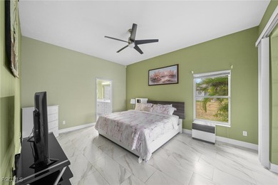 Highly desirable Gulf access home in Southwest Cape Coral, fully on Royal Tee Country Club in Florida - for sale on GolfHomes.com, golf home, golf lot