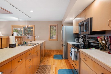 Usually, you have to choose between a golf course setting, water on Grand Traverse Resort and Spa in Michigan - for sale on GolfHomes.com, golf home, golf lot