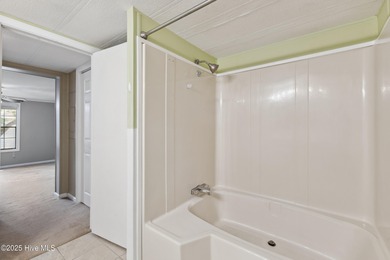 *PRICE REDUCED* This well-maintained home, with a fenced-in on Oyster Bay Golf Links in North Carolina - for sale on GolfHomes.com, golf home, golf lot