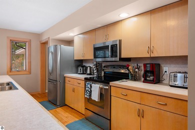 Usually, you have to choose between a golf course setting, water on Grand Traverse Resort and Spa in Michigan - for sale on GolfHomes.com, golf home, golf lot