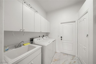 Highly desirable Gulf access home in Southwest Cape Coral, fully on Royal Tee Country Club in Florida - for sale on GolfHomes.com, golf home, golf lot