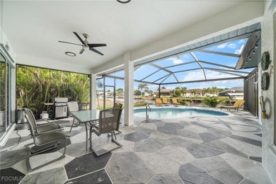 Highly desirable Gulf access home in Southwest Cape Coral, fully on Royal Tee Country Club in Florida - for sale on GolfHomes.com, golf home, golf lot