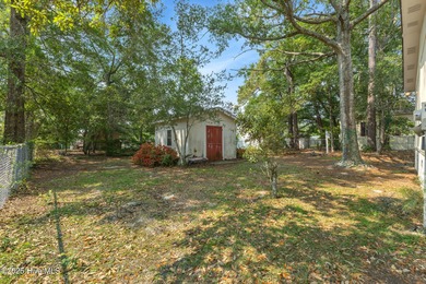 *PRICE REDUCED* This well-maintained home, with a fenced-in on Oyster Bay Golf Links in North Carolina - for sale on GolfHomes.com, golf home, golf lot