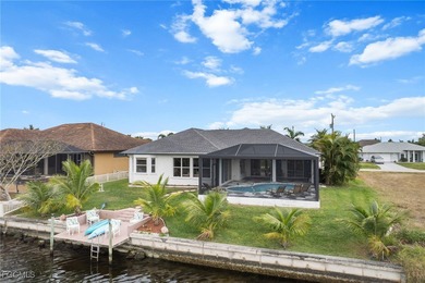 Highly desirable Gulf access home in Southwest Cape Coral, fully on Royal Tee Country Club in Florida - for sale on GolfHomes.com, golf home, golf lot
