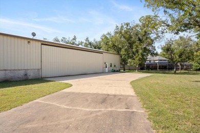 Bring your plane, boat, RV, horses, and golf clubs, this gated on Pecan Plantation Country Club in Texas - for sale on GolfHomes.com, golf home, golf lot