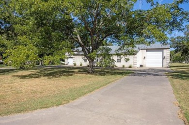 Bring your plane, boat, RV, horses, and golf clubs, this gated on Pecan Plantation Country Club in Texas - for sale on GolfHomes.com, golf home, golf lot