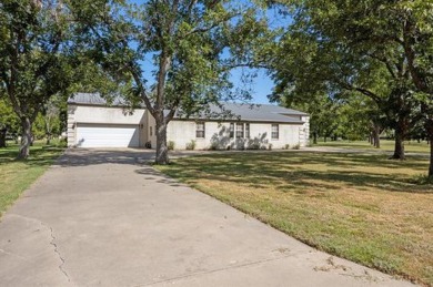 Bring your plane, boat, RV, horses, and golf clubs, this gated on Pecan Plantation Country Club in Texas - for sale on GolfHomes.com, golf home, golf lot