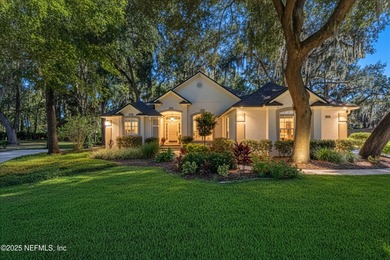Enjoy a peaceful backyard with mature trees surrounding this on Country Club of Orange Park in Florida - for sale on GolfHomes.com, golf home, golf lot