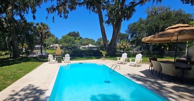 WATERFRONT, saltwater POOL home with no flood insurance needed! on Palm Harbor Golf Club in Florida - for sale on GolfHomes.com, golf home, golf lot