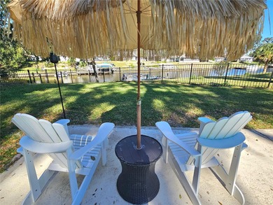 WATERFRONT, saltwater POOL home with no flood insurance needed! on Palm Harbor Golf Club in Florida - for sale on GolfHomes.com, golf home, golf lot