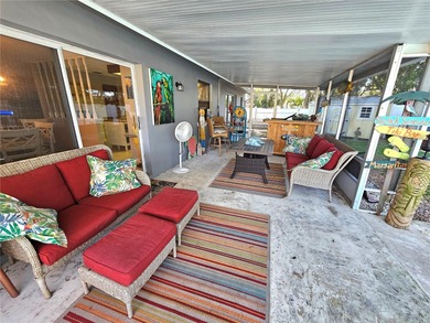 WATERFRONT, saltwater POOL home with no flood insurance needed! on Palm Harbor Golf Club in Florida - for sale on GolfHomes.com, golf home, golf lot