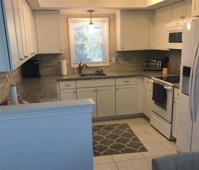 Do you like to play Golf? Are you looking for a place in a quiet on Palm Harbor Golf Club in Florida - for sale on GolfHomes.com, golf home, golf lot