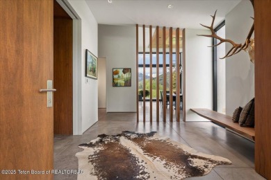 Perched above the Snake River with commanding views of Wolf on Snake River Sporting Club in Wyoming - for sale on GolfHomes.com, golf home, golf lot