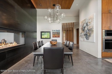 Perched above the Snake River with commanding views of Wolf on Snake River Sporting Club in Wyoming - for sale on GolfHomes.com, golf home, golf lot