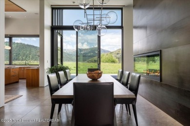 Perched above the Snake River with commanding views of Wolf on Snake River Sporting Club in Wyoming - for sale on GolfHomes.com, golf home, golf lot