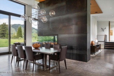 Perched above the Snake River with commanding views of Wolf on Snake River Sporting Club in Wyoming - for sale on GolfHomes.com, golf home, golf lot