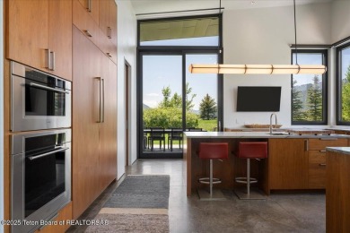 Perched above the Snake River with commanding views of Wolf on Snake River Sporting Club in Wyoming - for sale on GolfHomes.com, golf home, golf lot