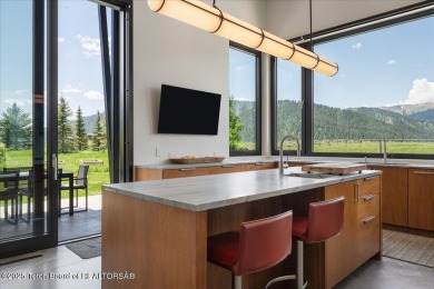 Perched above the Snake River with commanding views of Wolf on Snake River Sporting Club in Wyoming - for sale on GolfHomes.com, golf home, golf lot