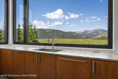 Perched above the Snake River with commanding views of Wolf on Snake River Sporting Club in Wyoming - for sale on GolfHomes.com, golf home, golf lot