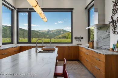 Perched above the Snake River with commanding views of Wolf on Snake River Sporting Club in Wyoming - for sale on GolfHomes.com, golf home, golf lot