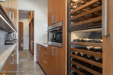 Perched above the Snake River with commanding views of Wolf on Snake River Sporting Club in Wyoming - for sale on GolfHomes.com, golf home, golf lot
