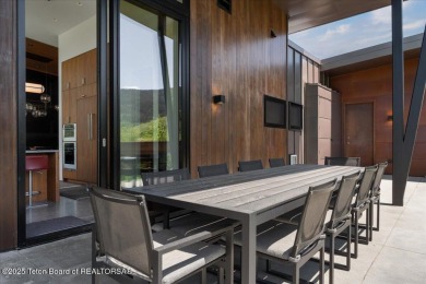 Perched above the Snake River with commanding views of Wolf on Snake River Sporting Club in Wyoming - for sale on GolfHomes.com, golf home, golf lot