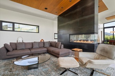 Perched above the Snake River with commanding views of Wolf on Snake River Sporting Club in Wyoming - for sale on GolfHomes.com, golf home, golf lot