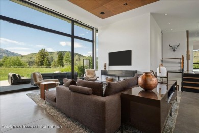 Perched above the Snake River with commanding views of Wolf on Snake River Sporting Club in Wyoming - for sale on GolfHomes.com, golf home, golf lot