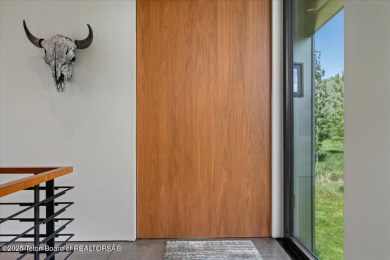 Perched above the Snake River with commanding views of Wolf on Snake River Sporting Club in Wyoming - for sale on GolfHomes.com, golf home, golf lot